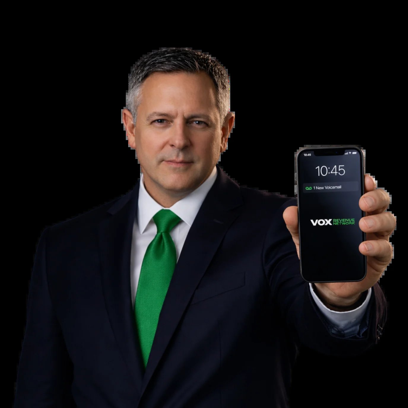 Professional man in dark suit and green tie holding smartphone displaying VOX app at 10:45